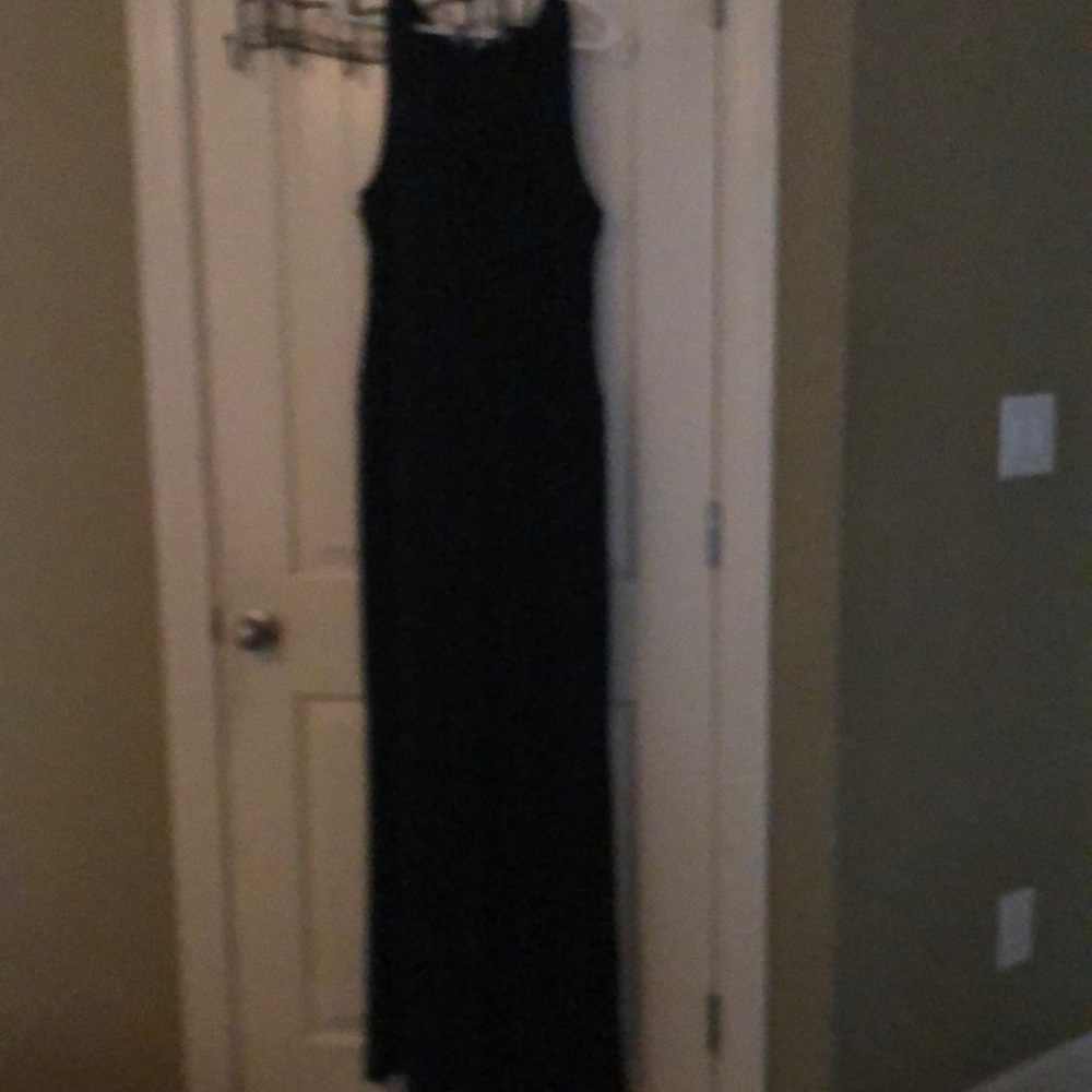 Black sleeveless rayon and polyester jump suit.